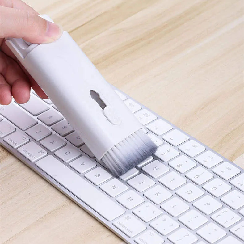 Multifunction electronics cleaning kit with foldable pen, spray bottle, brush, and keycap puller on a white background.