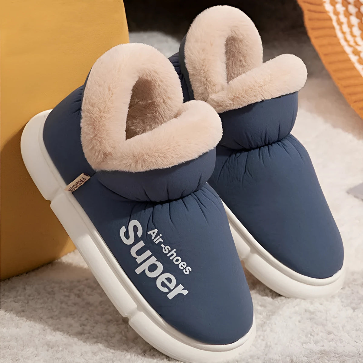 Warm house slippers with plush fleece lining and high back heel, shown in assorted colours.