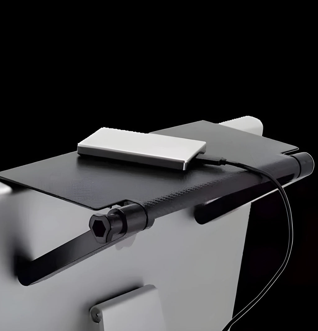 Black adjustable screen top shelf, 13-inch wide, mounted on TV, holding streaming device and remote