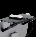 Black adjustable screen top shelf, 13-inch wide, mounted on TV, holding streaming device and remote