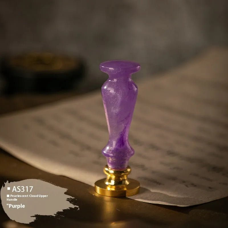 Wooden wax seal handle with brass fittings shown in a selection of different styles and colour finishes.