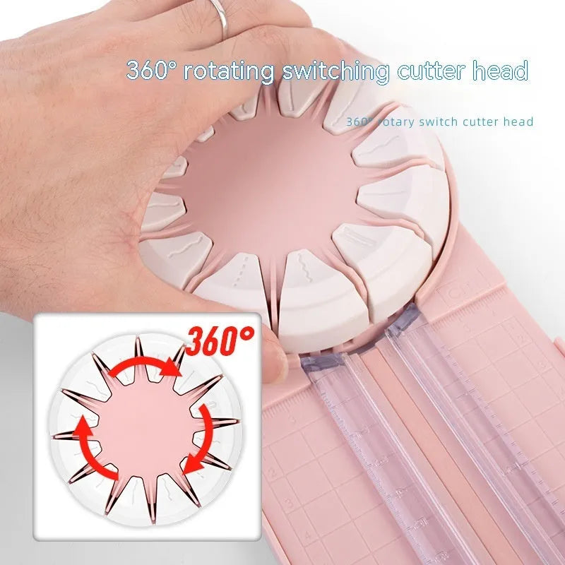 Pink and black 12-in-1 dotted plastic paper cutting machine on a white background.