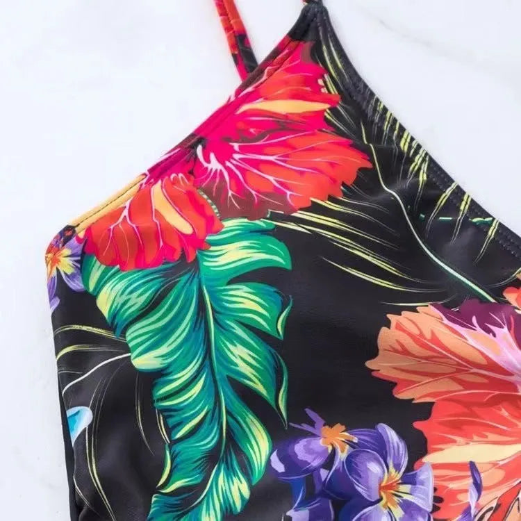Black printed high waist women's bikini briefs on a white background.