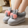 Women's grey plush high-heel winter slippers with a thick, anti-slip TPR sole.