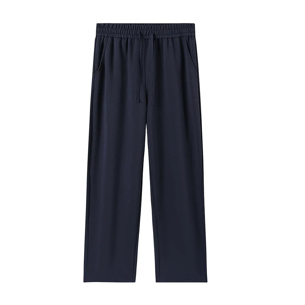 High-waisted straight-leg cotton trousers in loose fit, shown in available colours, sizes M to 3XL