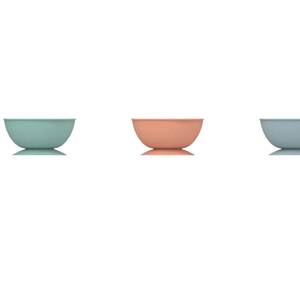 Cyan silicone pet slow feeder bowl with textured surface and suction cup base