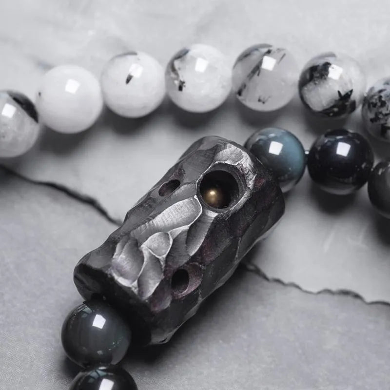 Ethnic style black hair crystal bracelet with white crystal tassel showing lacing construction