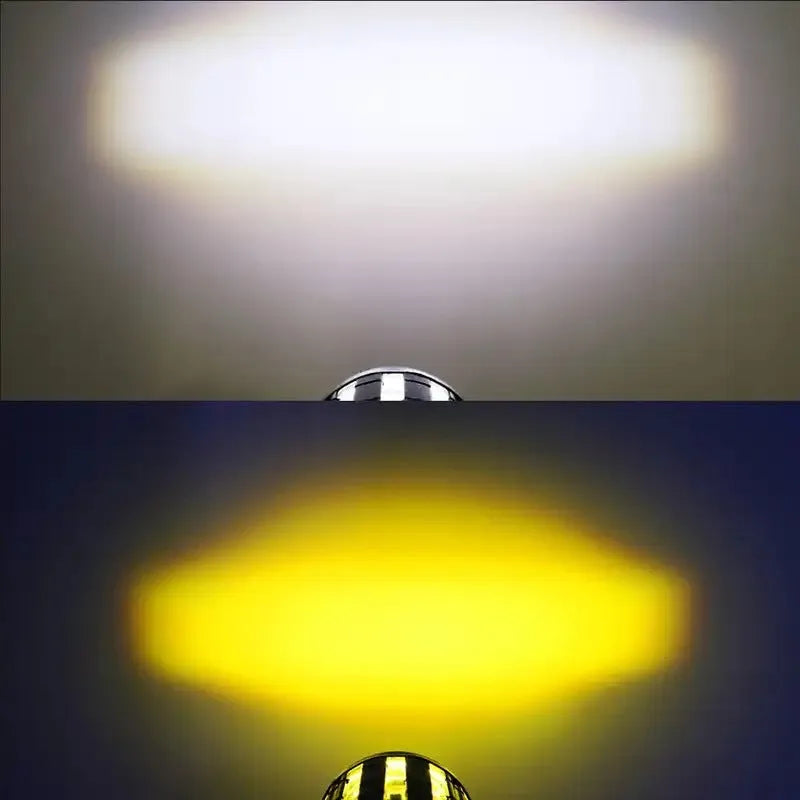 Motorcycle spotlight with dual-colour lens, aluminium housing, showing white and yellow light modes.