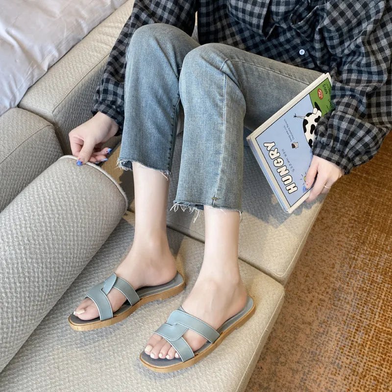 Women's cross strap PVC sandal in light blue with a toe ring and non-slip sole.