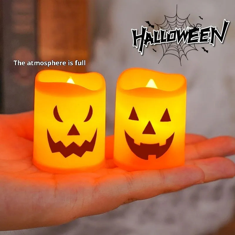 Set of six pumpkin-coloured plastic electric candle lamps arranged for Halloween decoration
