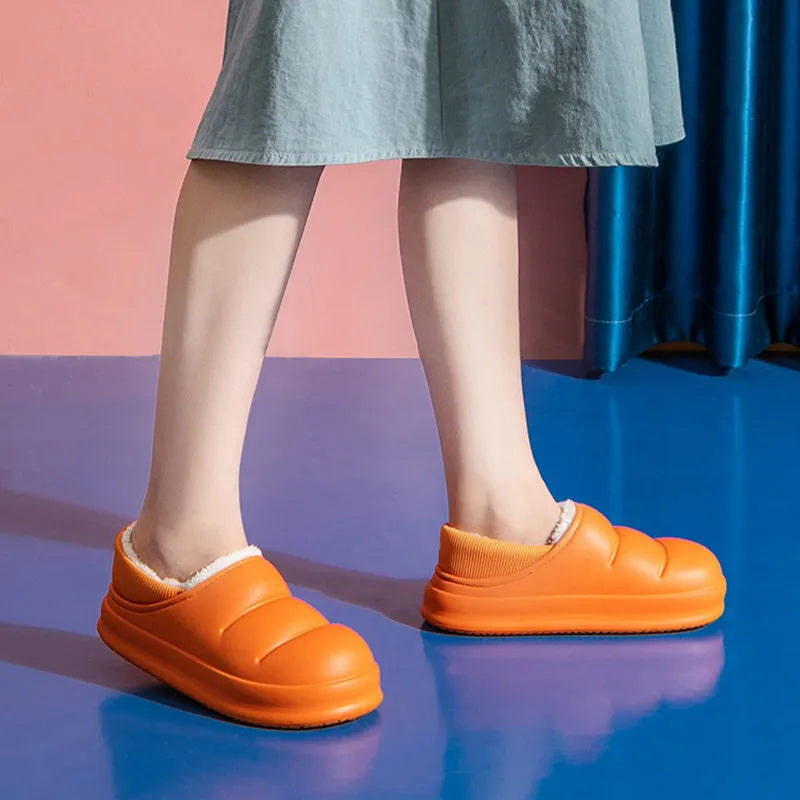 Yellow waterproof EVA garden slippers with a plush lining and textured non-slip sole.