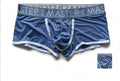 Men's low waist ice silk shorts in solid colours like army green and black, laid flat.