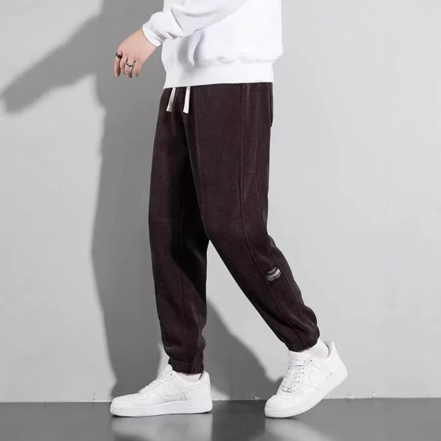 Men's loose straight drapey sweatpants in dark gray with drawstring waist and cotton blend fabric