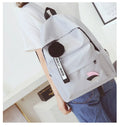 Canvas college style schoolbag in green colour showing front view with dimensions 40x28x13cm