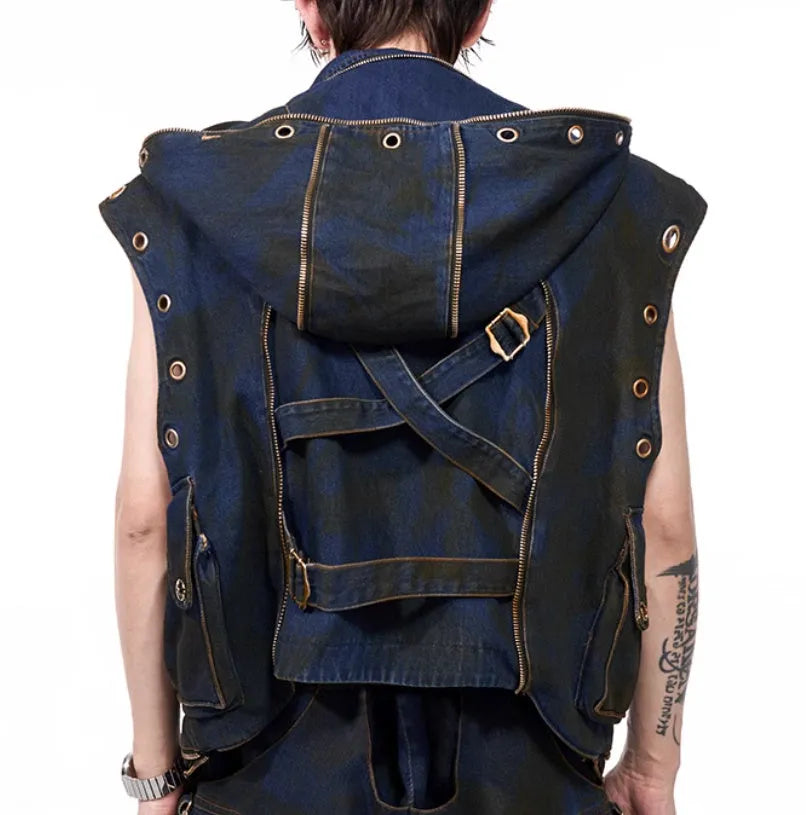 Blue hooded denim vest coat and matching trousers laid flat.