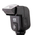 Compact SLR camera flash accessory with its head tilted upwards, showing its 90-degree adjustment range on a hot shoe.