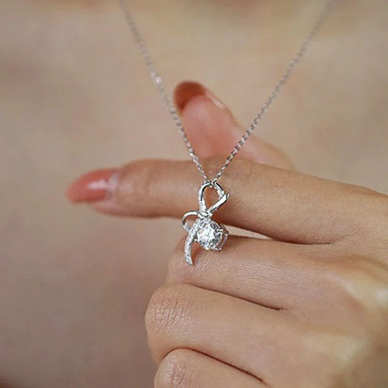 Bow necklace for women in XL1511 White Gold with inlaid zircon, copper base, and O-ring chain, 21-50cm.