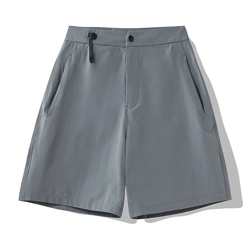 Man wearing solid-colour quick-dry sports shorts with an elastic waistband for running or climbing.