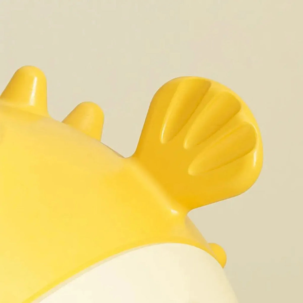 Yellow durable vinyl fish-shaped dog chew toy with squeaker for aggressive chewers.