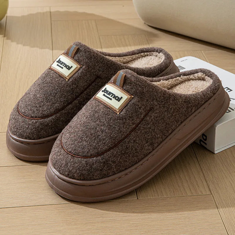 Men's brown thickened cotton slippers with a suede upper and textured sole, shown from the side.