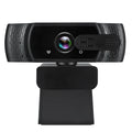 Black USB computer webcam with built-in microphone mounted on a laptop screen.