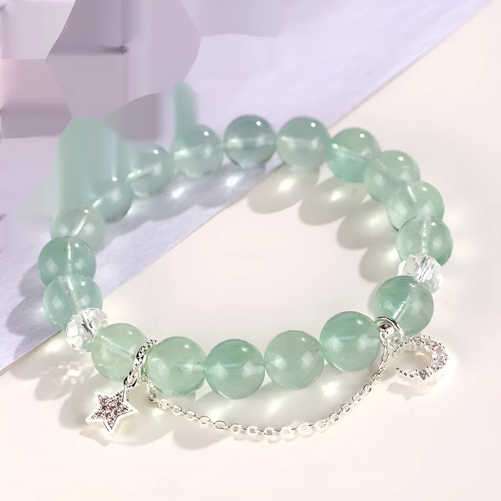 Green fluorite bracelet with star and moon princess design showing natural stone asterism patterns