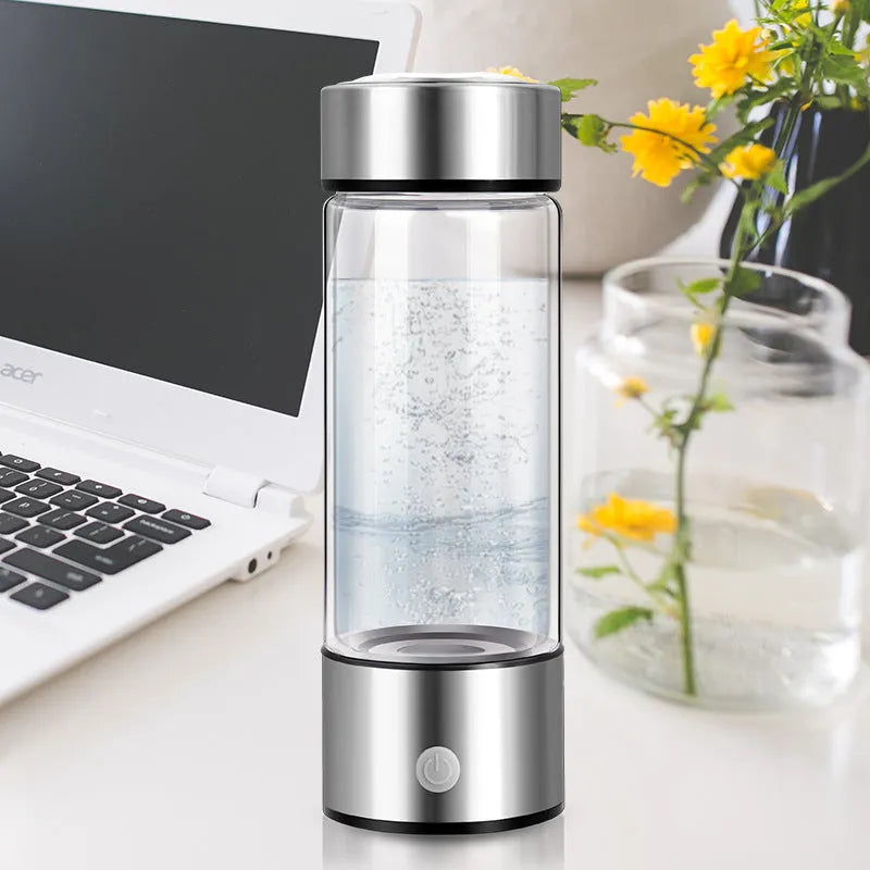 Silver electric hydrogen water bottle generator with borosilicate glass and rechargeable base