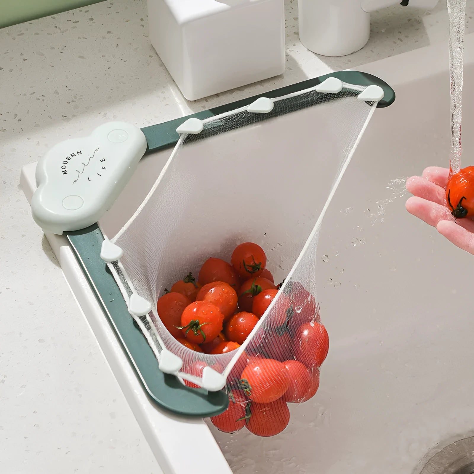 Green triangular ABS plastic sink drain rack with elastic mesh filter net installed in kitchen sink corner.