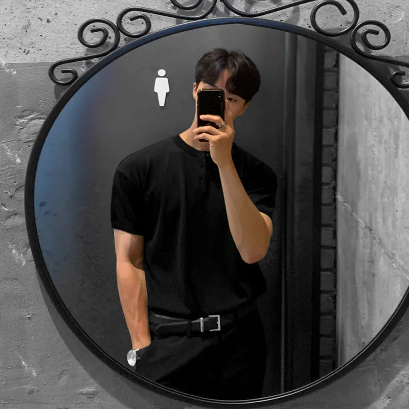 Men's black slim-fit short-sleeved knitted pullover shirt on a hanger