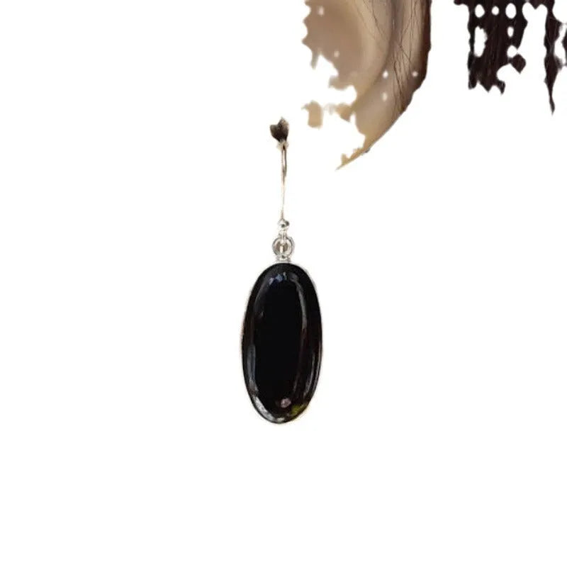 Women's black oval agate pendant earrings with 925 silver detail and geometric Chinese design