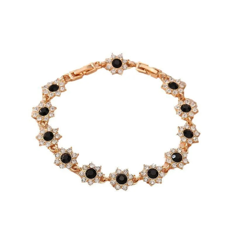 Luxury style bracelet with coloured gems and floral design on zinc alloy with electroplated finish