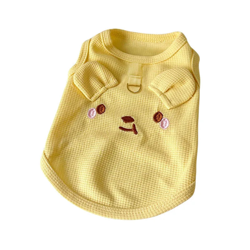 Yellow waffle knit dog vest on a mannequin showing casual style and textured fabric.