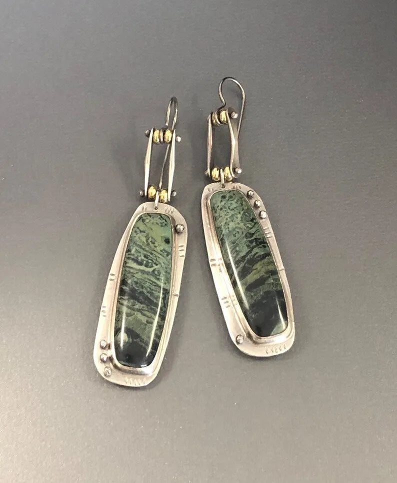 Geometric two-colour marble pattern alloy drop earrings showing marbled surface detail
