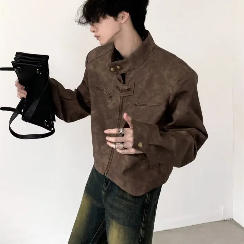 Men's retro brown PU leather short coat with tight fit and long sleeves on a plain background