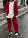 Long-sleeved coat and trousers two-piece set in a solid colour, loose street style fit.