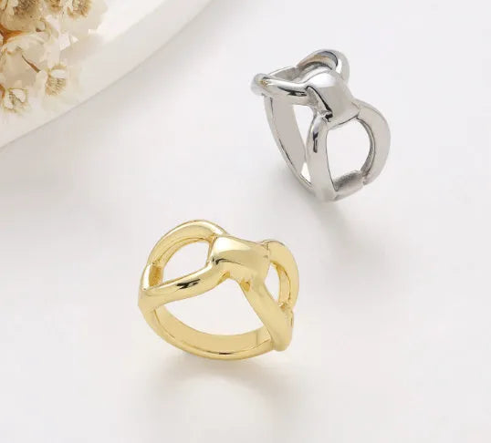 Women's titanium steel ring with butterfly hollow design and bow shape in gold colour