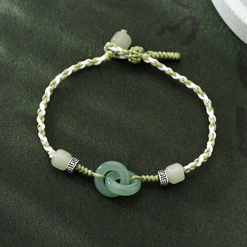Green copper bracelet with ethnic peace buckle design and jade double ring strap