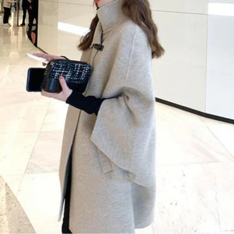 Women's Korean style long coat in oatmeal colour with flight sleeves and acrylic fabric