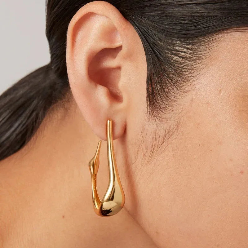 Copper plating 18K real gold irregular lines geometric needle ear studs on white background
