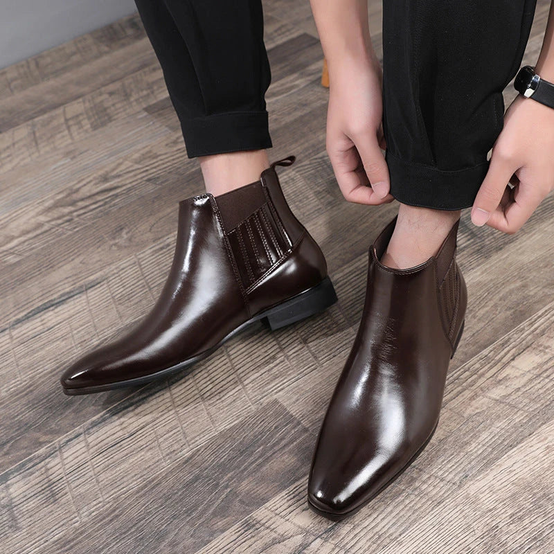 Stylish pointed-toe Chelsea boots for men in black and brown colors, featuring a square heel and sleek, British-inspired design.