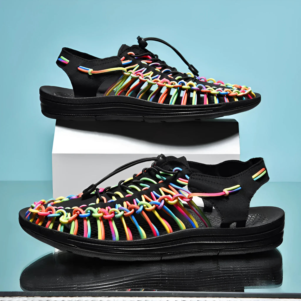 Adjustable drawstring tie woven sandals in multiple colours on a non-slip rubber sole.
