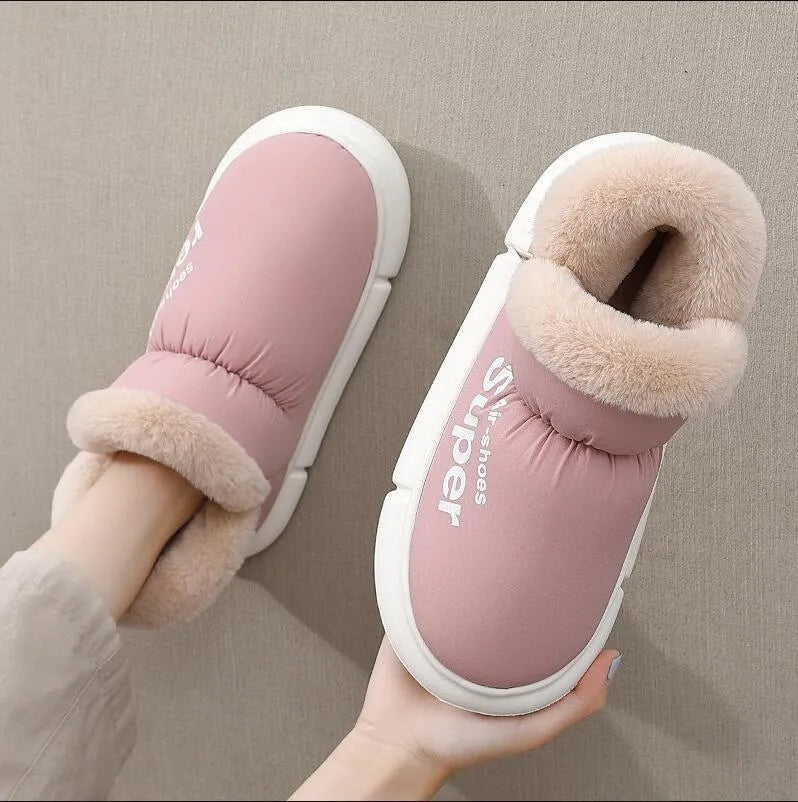 Warm house slippers with plush fleece lining and high back heel, shown in assorted colours.