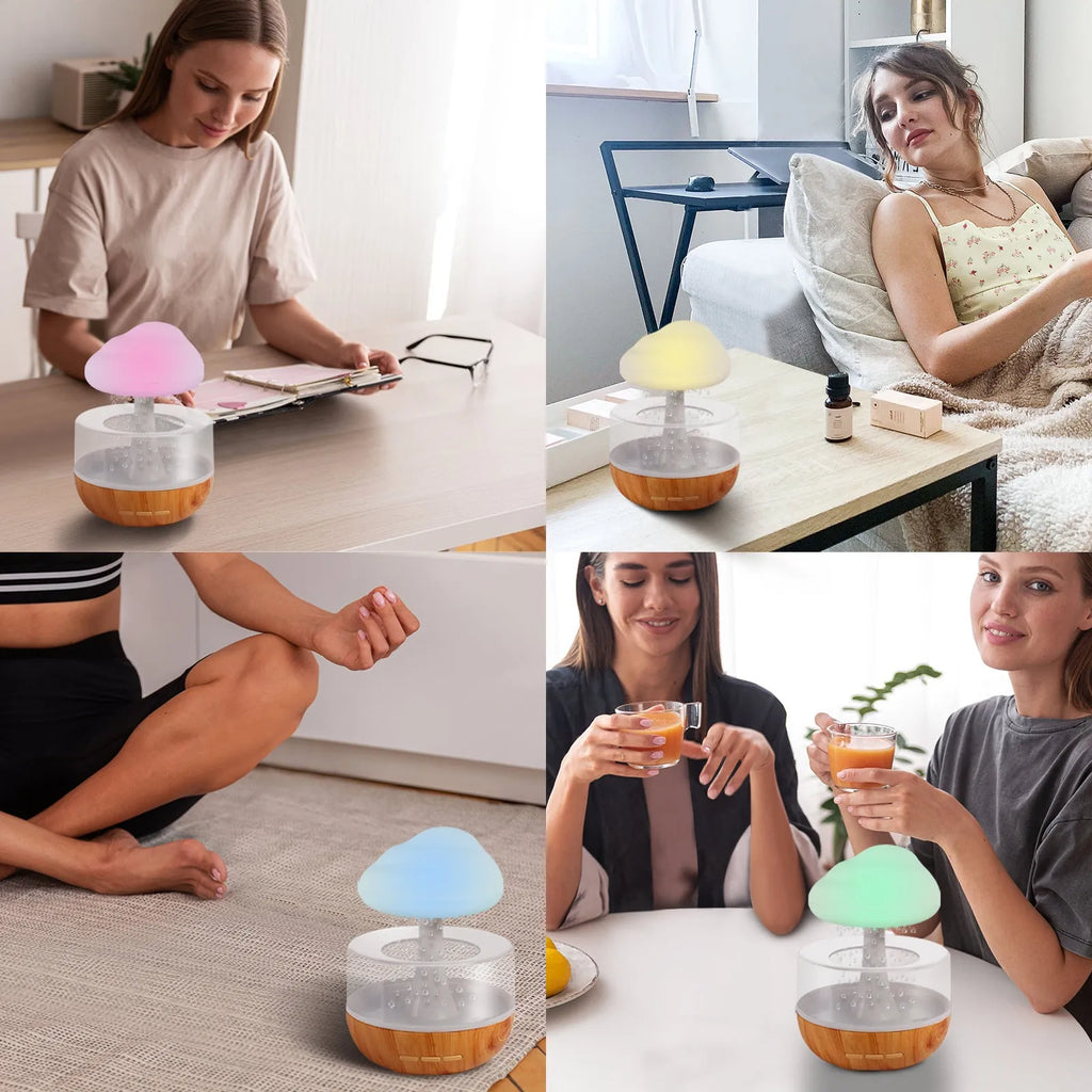 White cloud-shaped humidifier with LED night light and water droplet effect on a table.