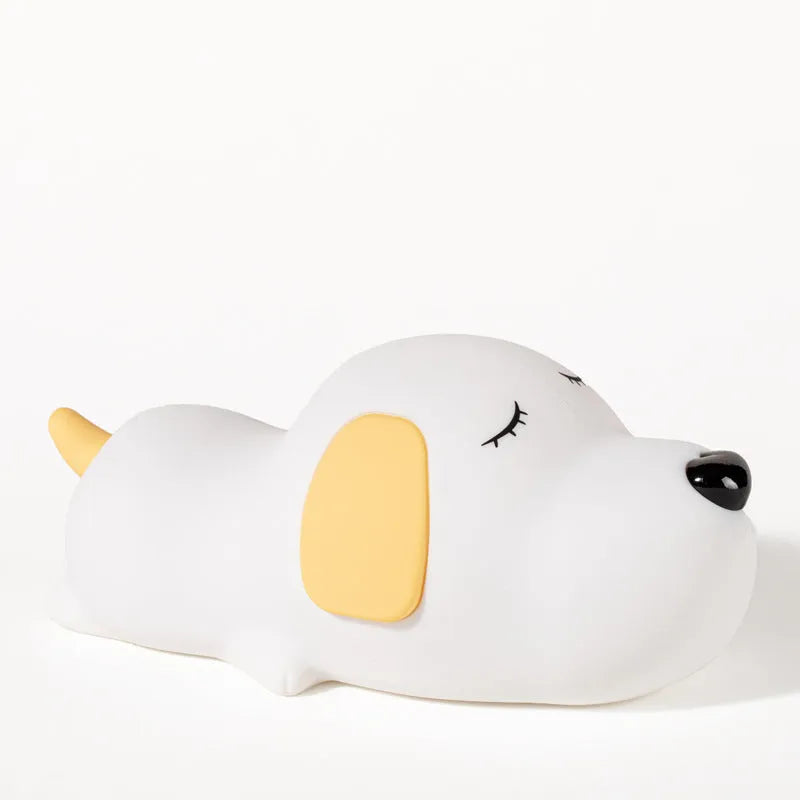 A two-tone cartoon dog-shaped silicone night lamp with a USB charging port.