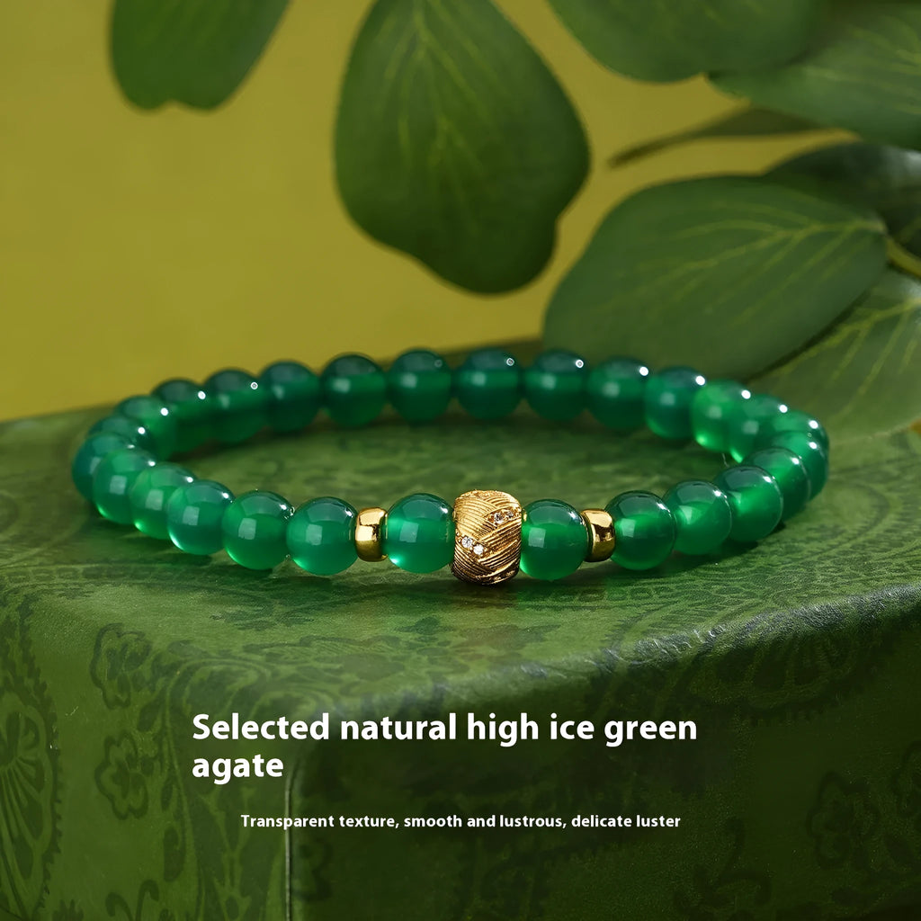Green agate and sterling silver bracelet with geometric beads and yellow gold plating.