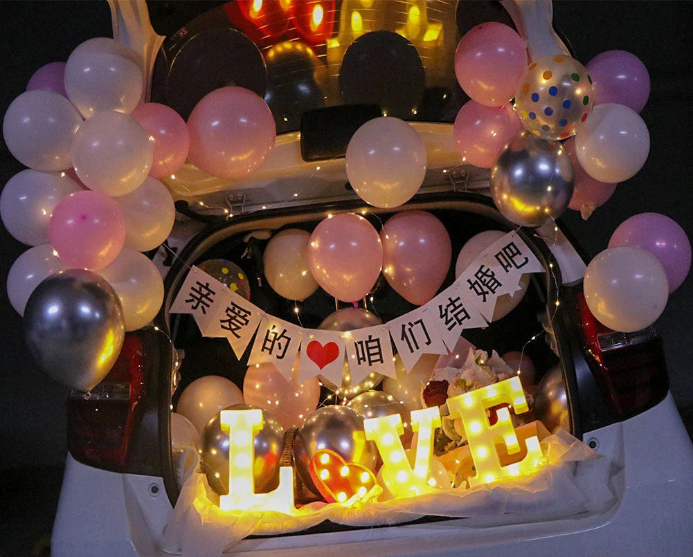 Romantic car trunk proposal decoration kit with balloons, ribbons, and accessories for creating a magical surprise