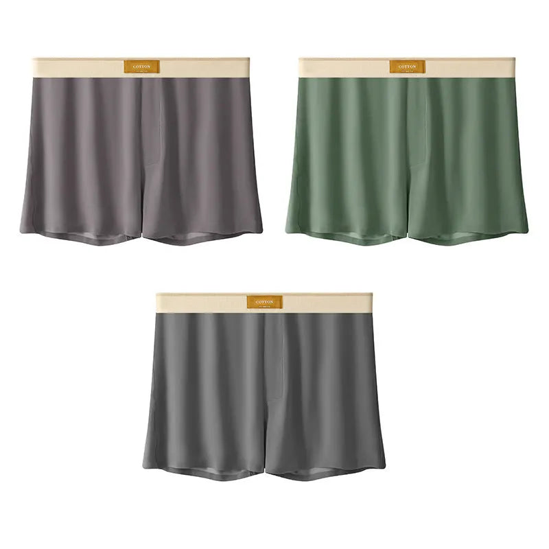 Pack of three pairs of men's solid colour loose fit ice silk nylon underwear on a white background.