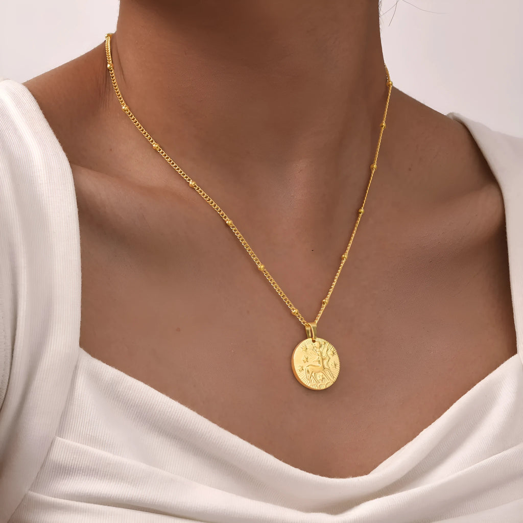 Stainless steel zodiac constellation bead necklace with twelve star signs on round geometric pendants and cross chain