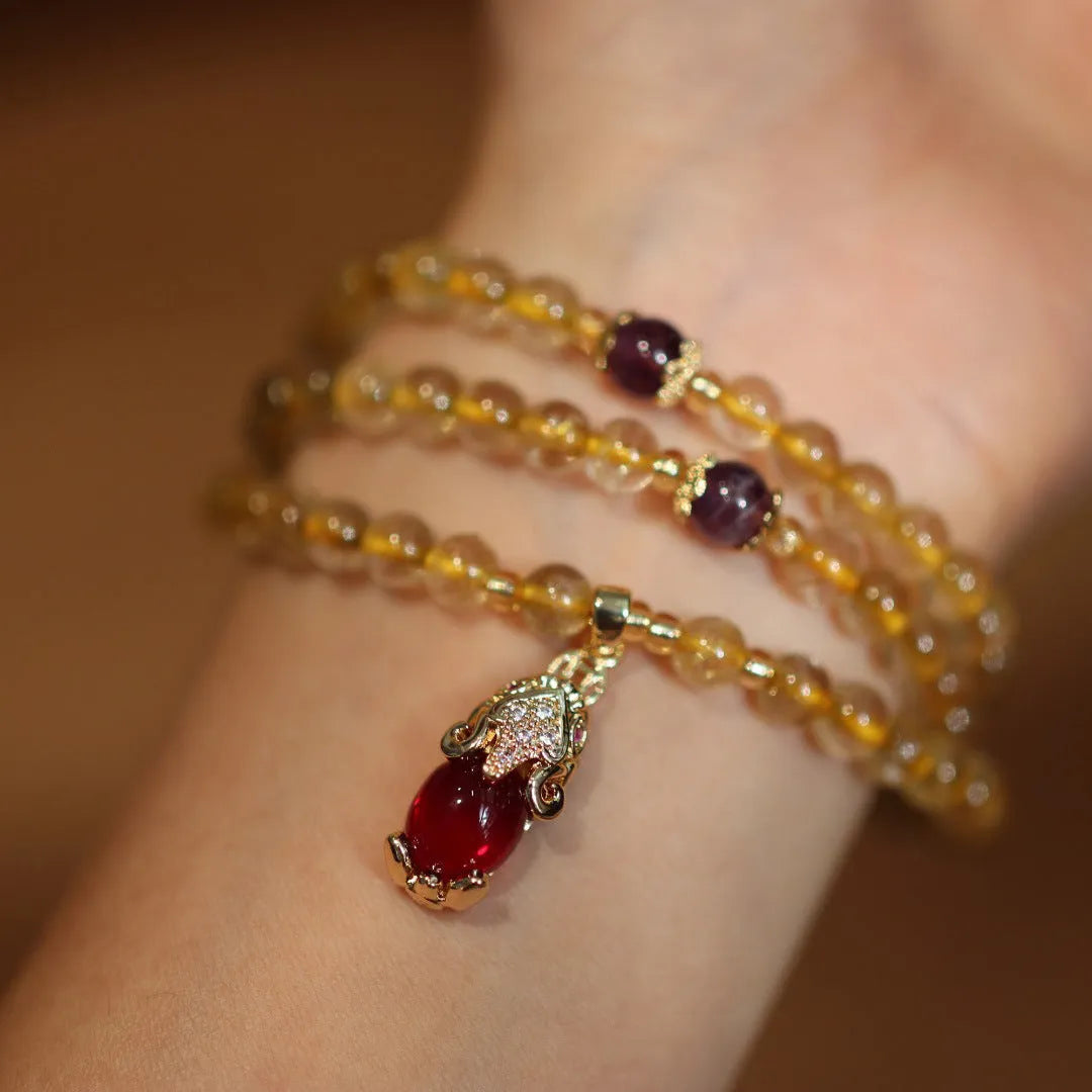 Natural Brazilian rutilated quartz bracelet with Chinese style three gold rings and hanging chopsticks design
