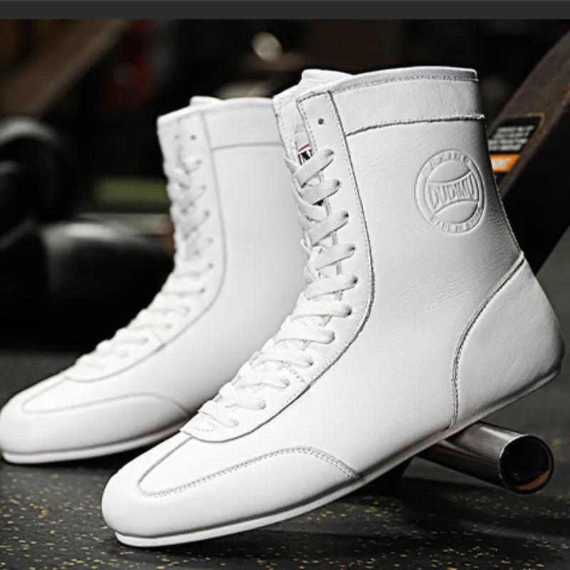 Professional black gold mesh boxing shoes with white leather panels and black detailing, shown in size 42.